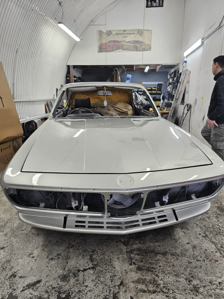 JD Autobodywork workshop interior with classic BMW restoration in progress